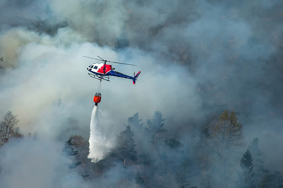 Helicopter extinguishing wildfire