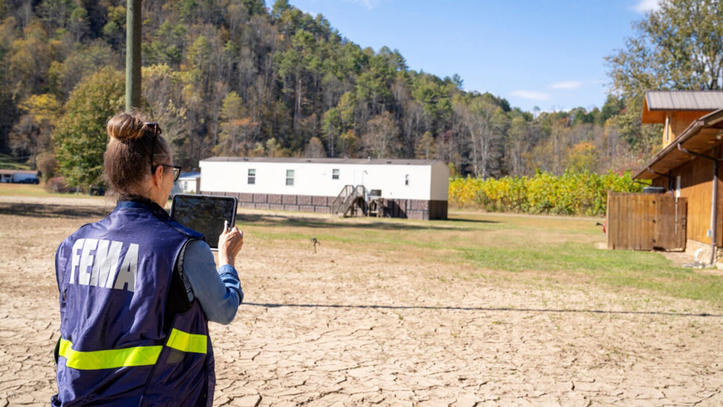 FEMA member outside using tablet